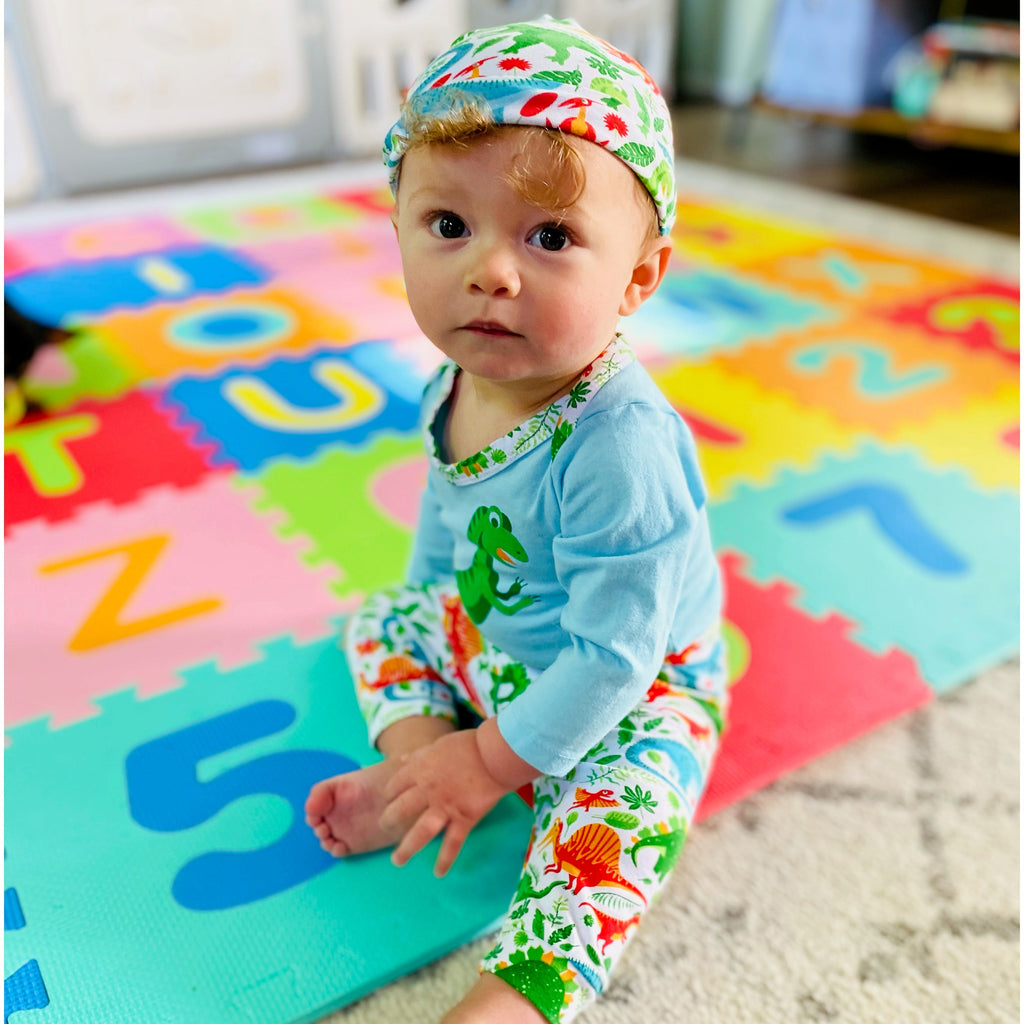 3-piece dinosaur baby layette set with green and white bodysuit, jogger pants, and cap — view 4
