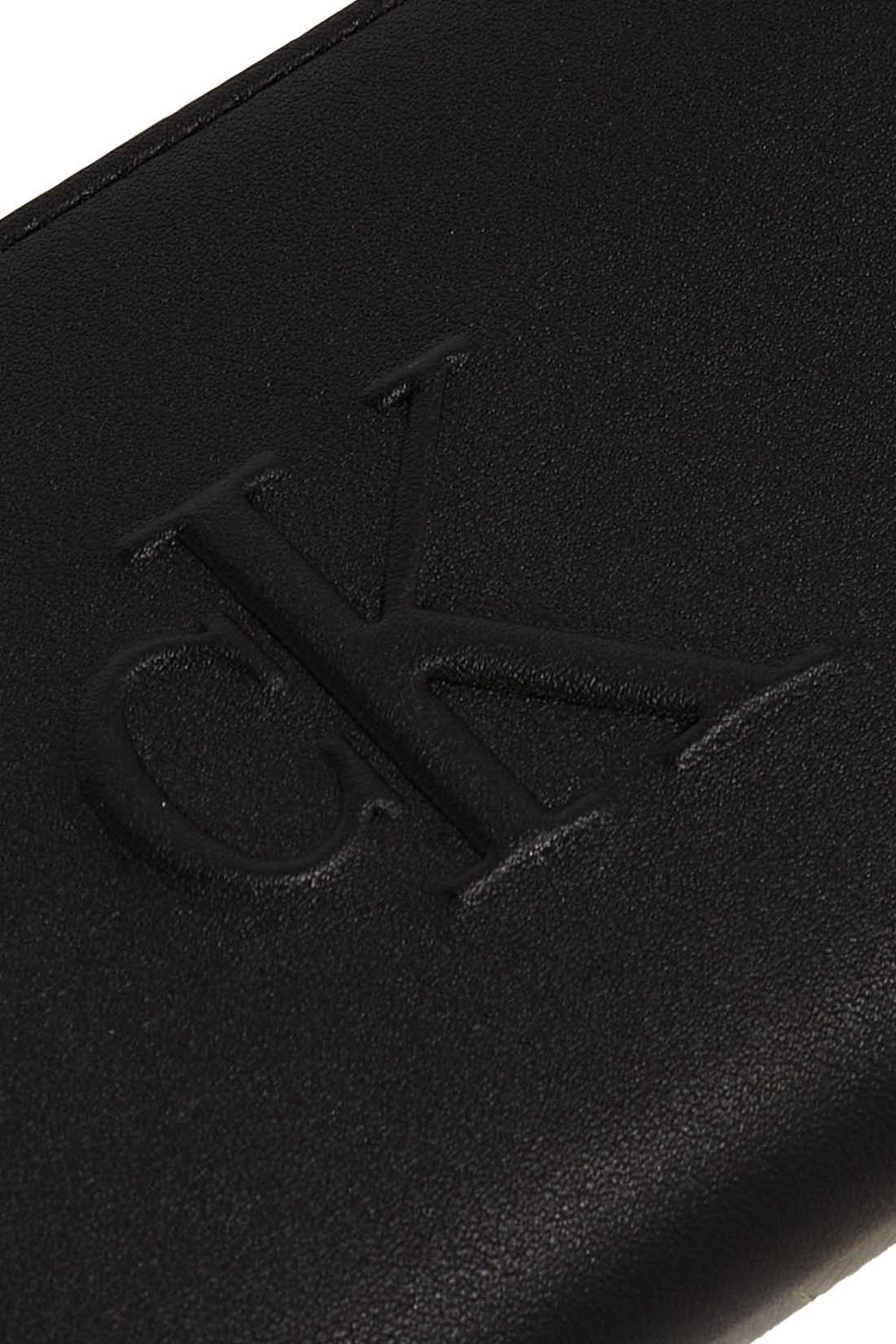 Smooth black women's faux leather zip-around wallet with embossed monogram and logo hardware