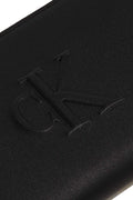 Smooth black women's faux leather zip-around wallet with embossed monogram and logo hardware