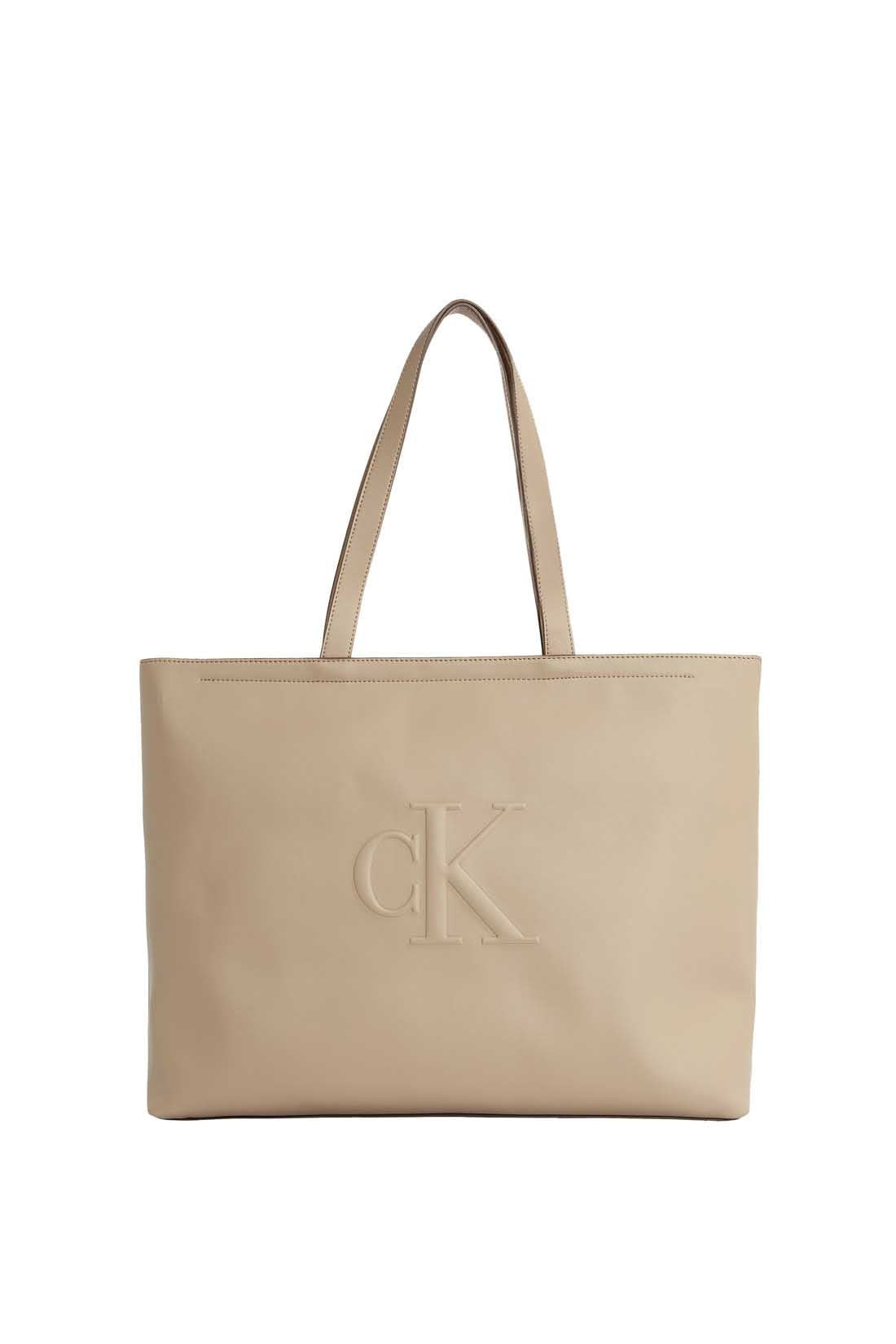 Womens black faux-leather tote bag with double handles and embossed monogram front detailing — view 10