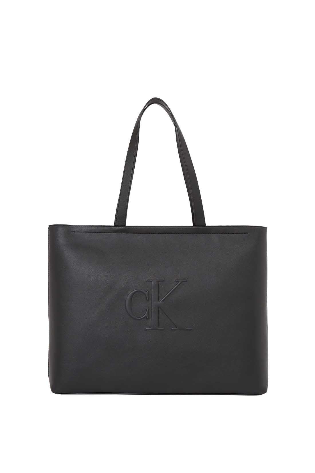 Womens black faux-leather tote bag with double handles and embossed monogram front detailing — view 15