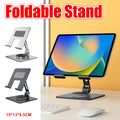 Silver carbon steel foldable tablet stand holding a device on a desk with a non-slip base