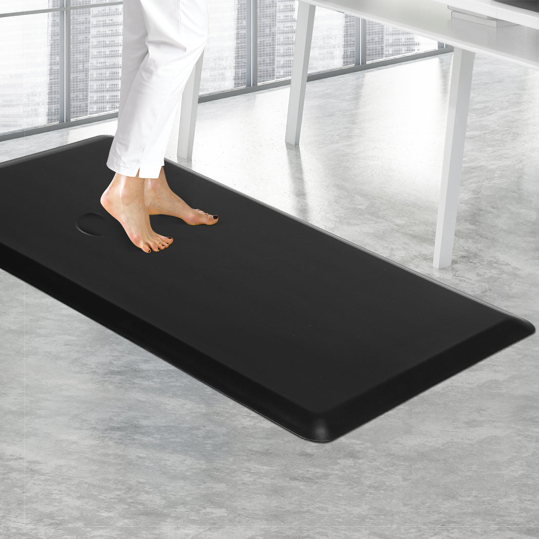 Large black anti-fatigue standing desk mat with bevelled edges made of waterproof PVC comfort foam — view 5