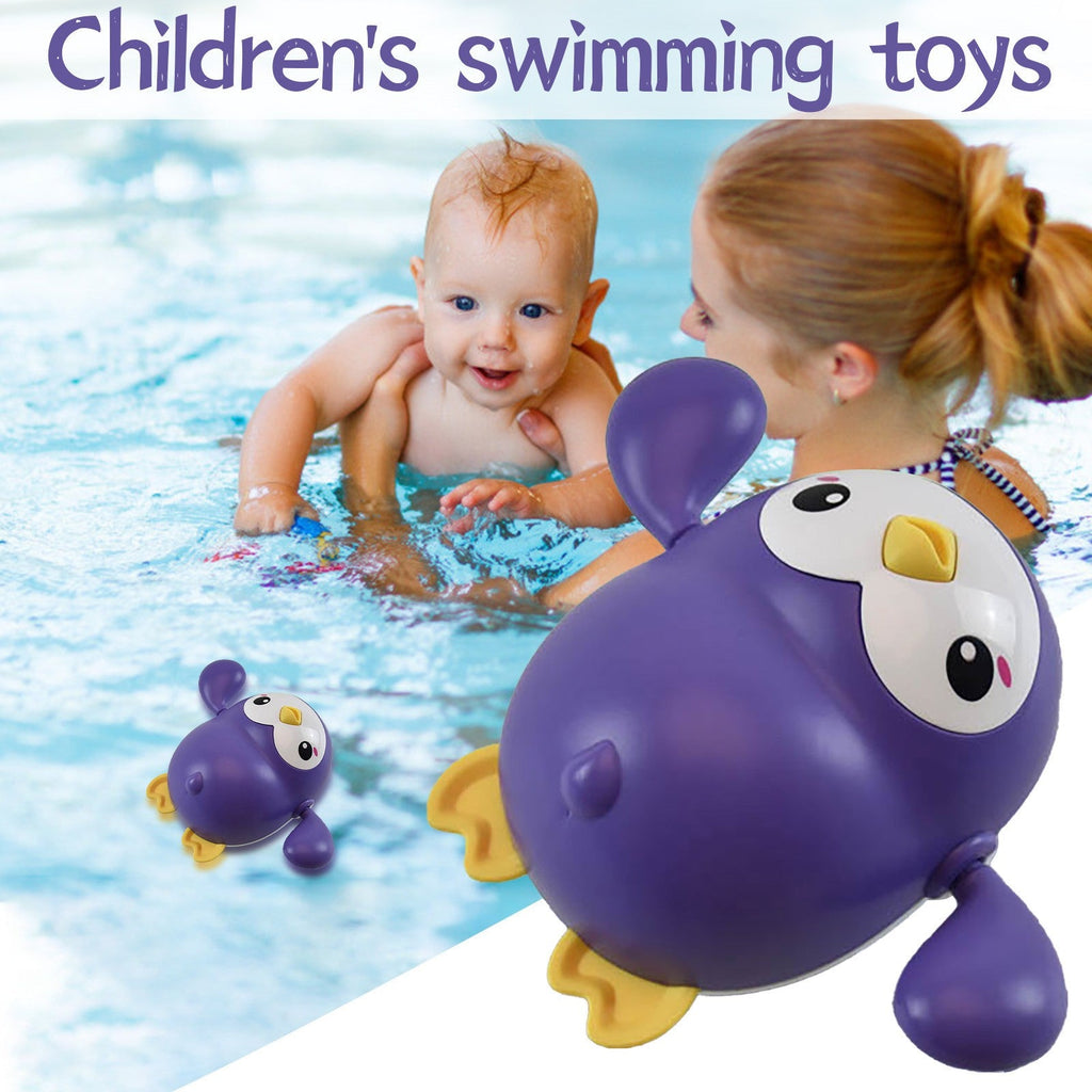 Little penguin wind-up bath toy for toddlers in bright colors floating on water