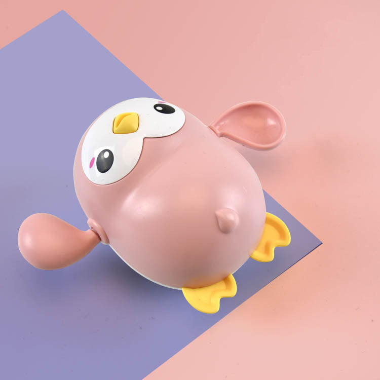 Little penguin wind-up bath toy for toddlers in bright colors floating on water — view 5
