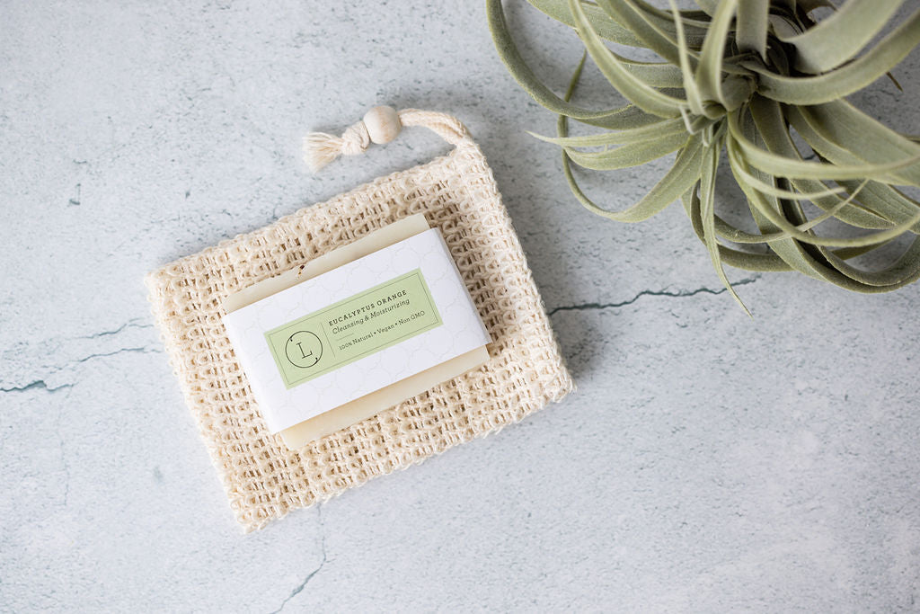 Two handmade natural eucalyptus cold process soap bars packed in a reusable cotton bag — view 3