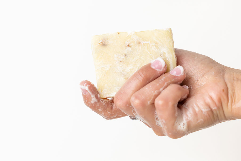 Two natural pink grapefruit handmade soap bars packed in a rustic cotton drawstring bag — view 5