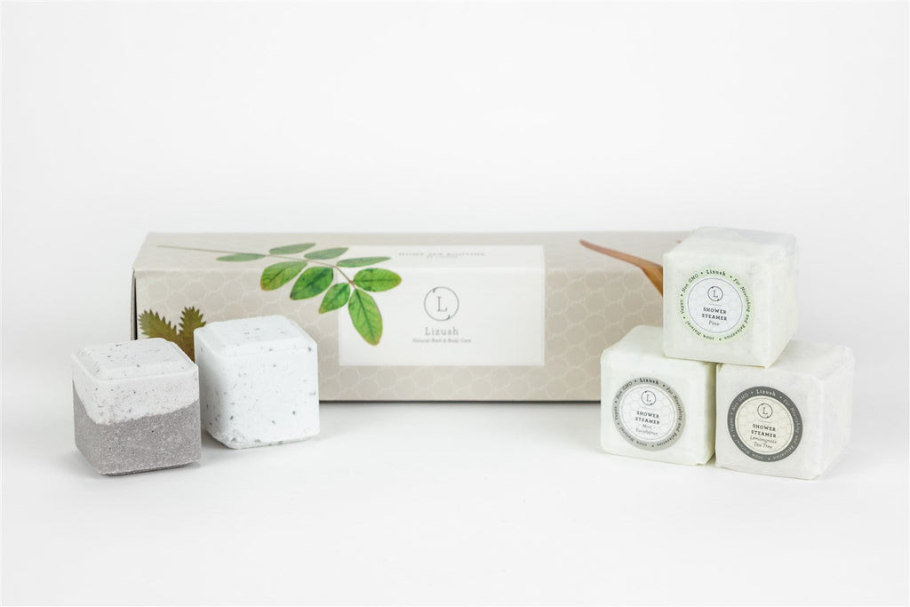 Set of five natural earthy shower steamers arranged in a beautifully packaged gift box