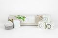 Set of five natural earthy shower steamers arranged in a beautifully packaged gift box