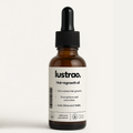 Lustrao botanical hair regrowth oil in a glass dropper bottle for thinning hair treatment