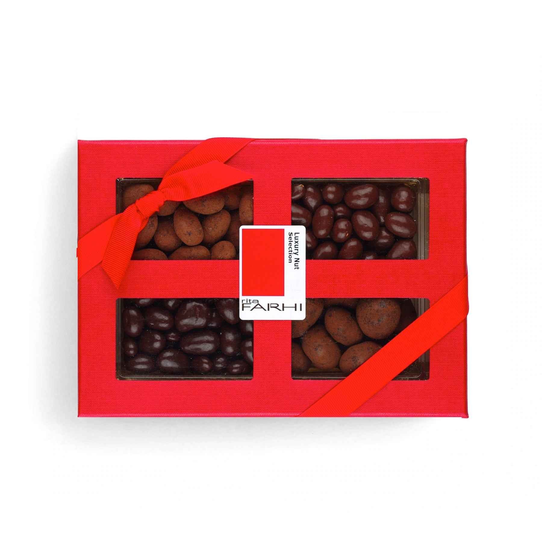 Assorted chocolate coated mixed nuts featuring almonds pistachios and pecans in a luxury gift box