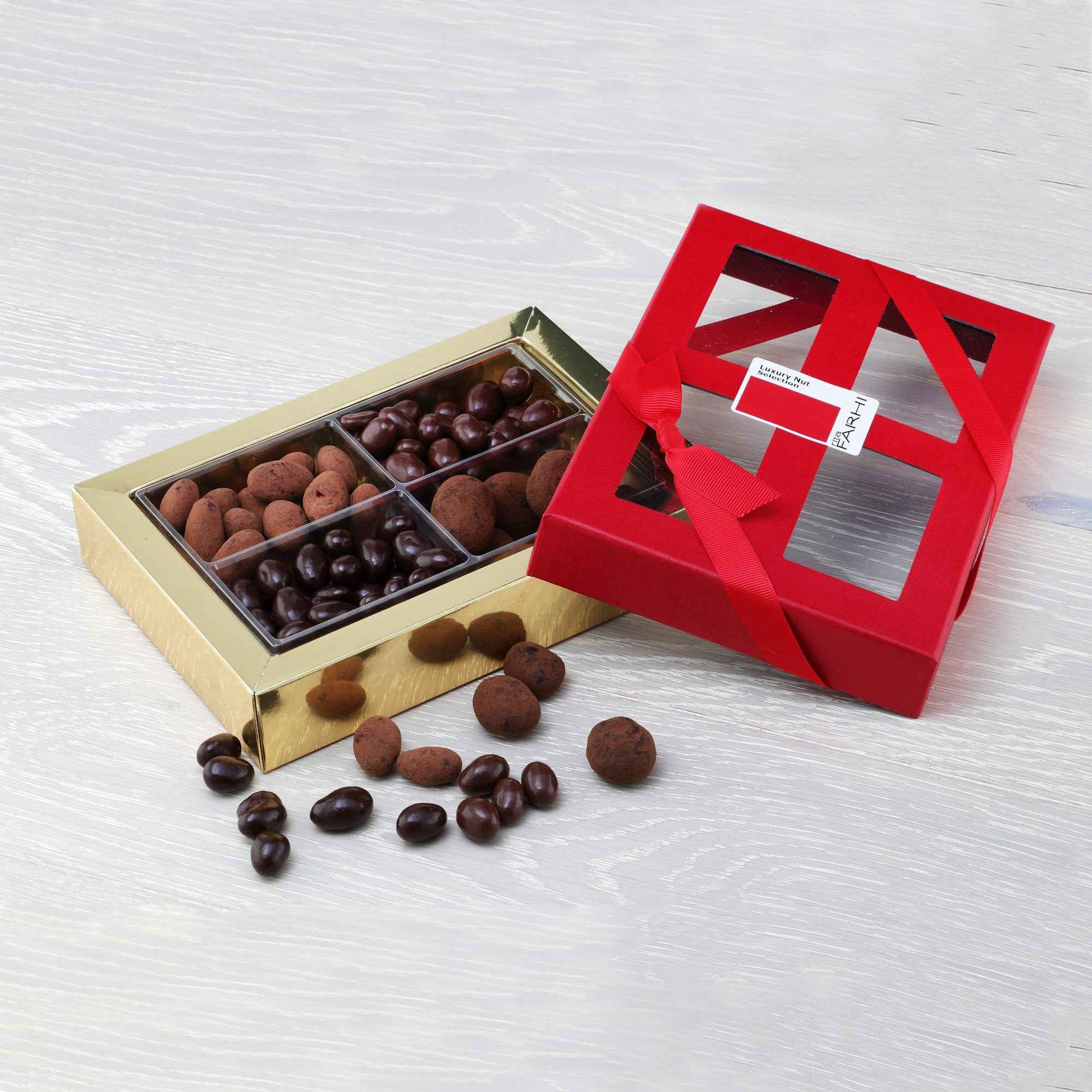 Assorted chocolate coated mixed nuts featuring almonds pistachios and pecans in a luxury gift box — view 2