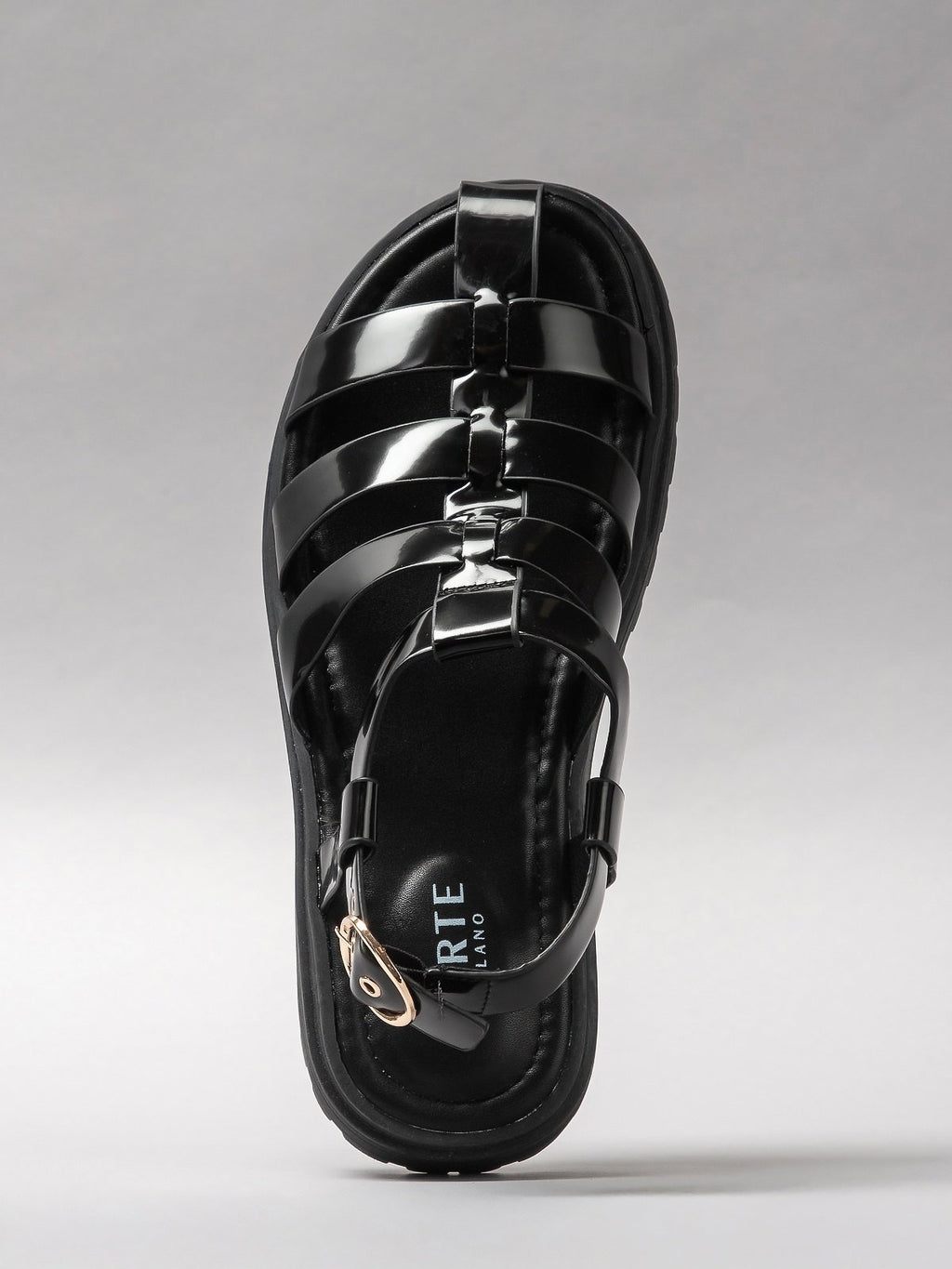 Pair of black women's sandals featuring minimalist synthetic straps and a comfortable flat walking sole — view 4