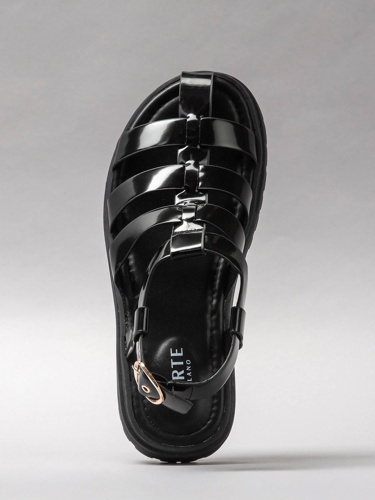 Pair of black women's sandals featuring minimalist synthetic straps and a comfortable flat walking sole — view 4