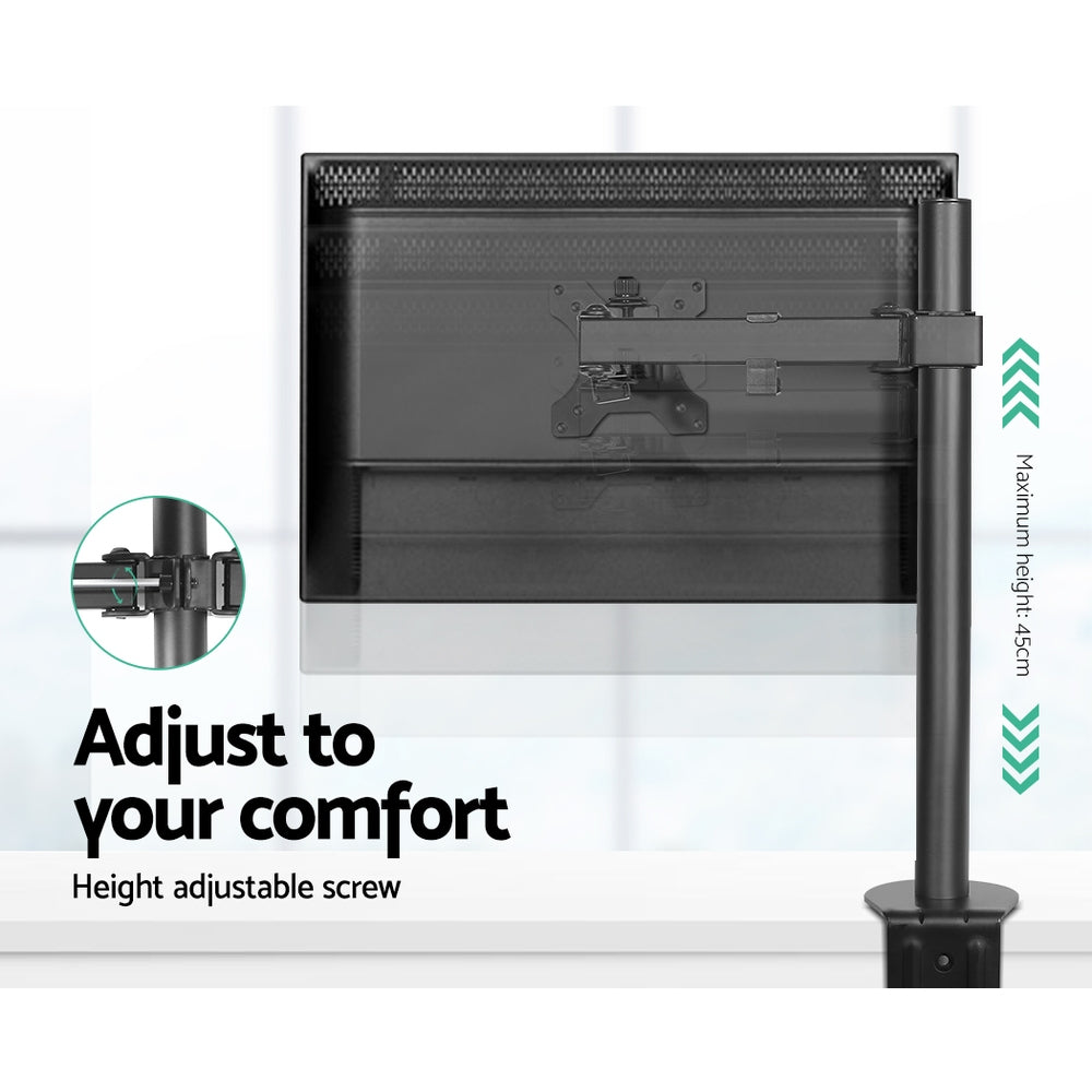 Black steel single monitor arm mount attached to a desk, holding a flat screen display — view 2