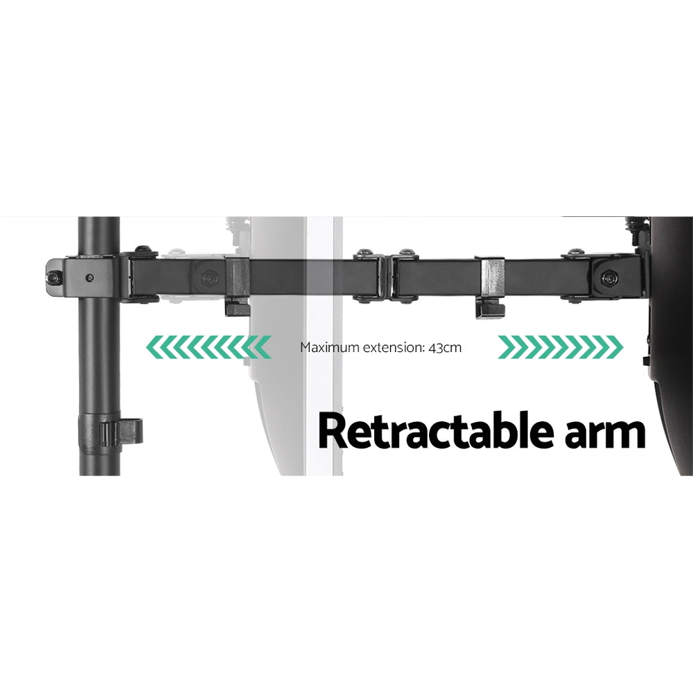 Black steel single monitor arm mount attached to a desk, holding a flat screen display — view 3