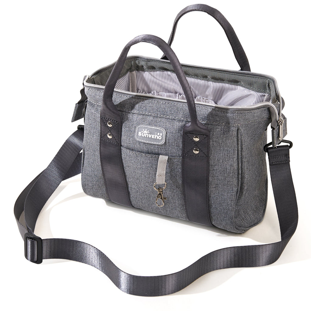 Small crossbody diaper bag in durable polyester with front pocket and bottle holders for modern parents