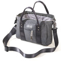 Small crossbody diaper bag in durable polyester with front pocket and bottle holders for modern parents