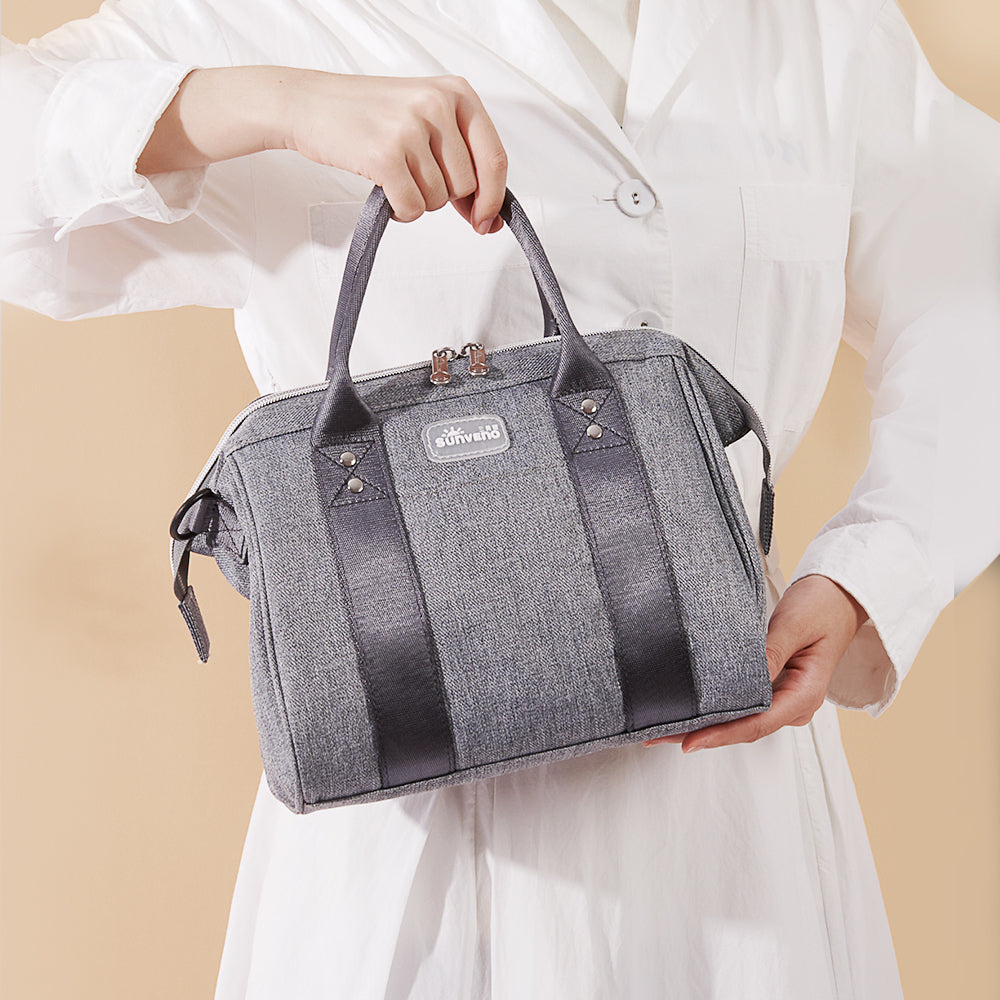 Small crossbody diaper bag in durable polyester with front pocket and bottle holders for modern parents — view 2
