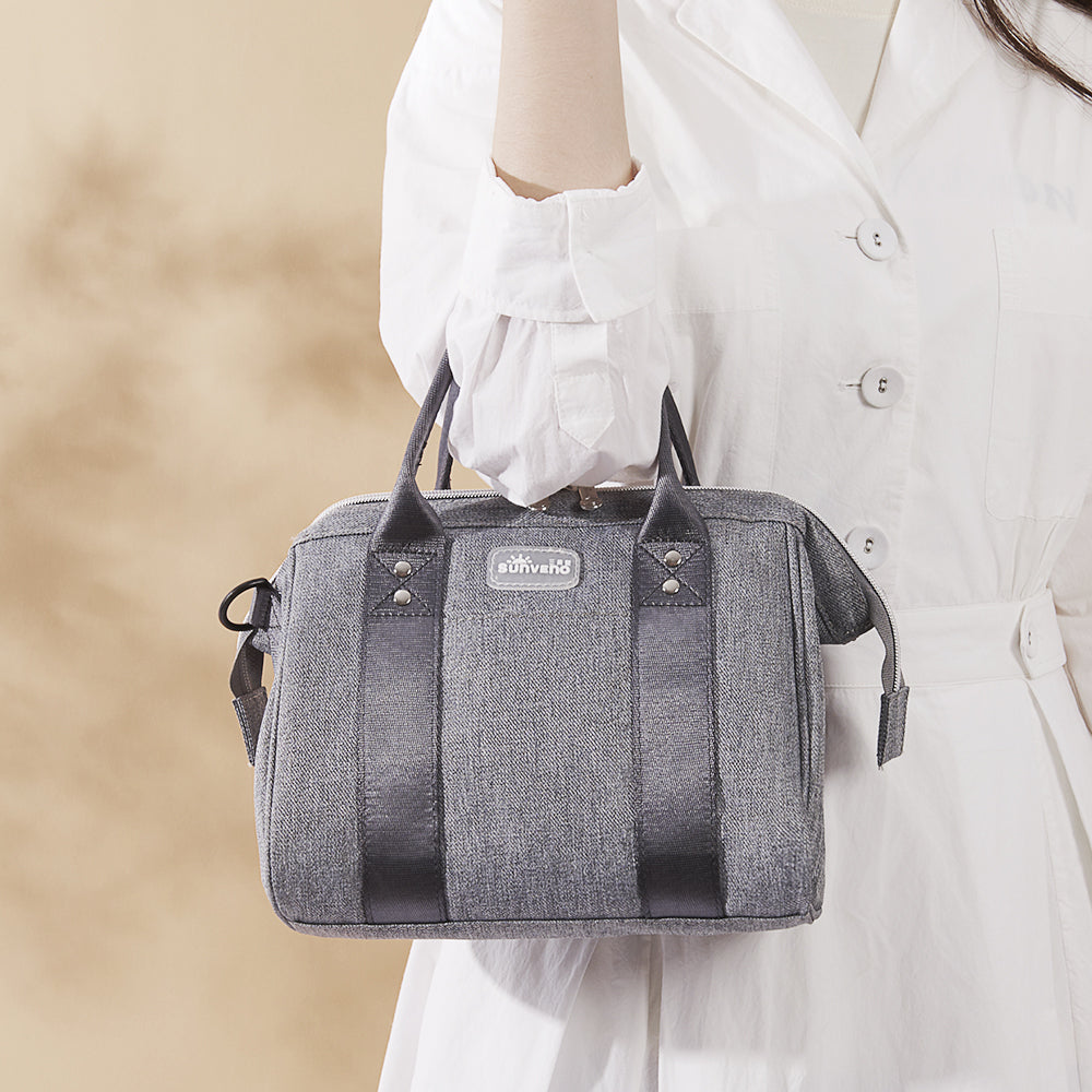 Small crossbody diaper bag in durable polyester with front pocket and bottle holders for modern parents — view 3