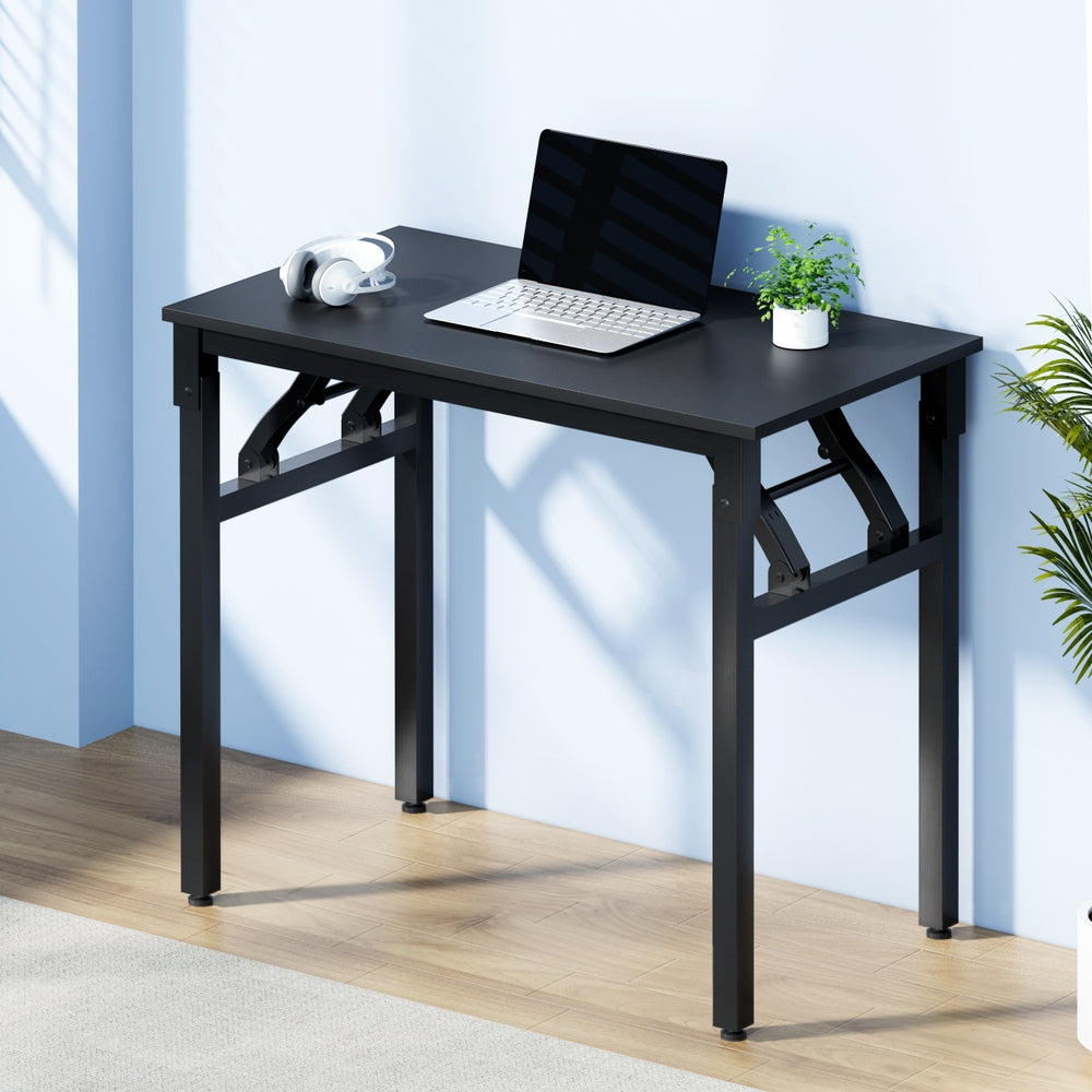 Artiss foldable computer desk in black, featuring a sturdy steel frame and wooden desktop surface.