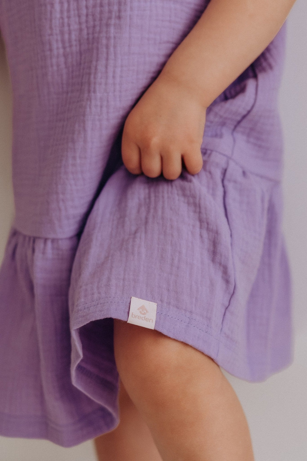 Minni girls dress with short sleeves and ruffled hem in lightweight cotton muslin fabric — view 4