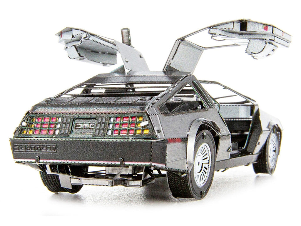 DeLorean metal model kit fully assembled showing brushed stainless steel finish and opening gull-wing doors — view 4