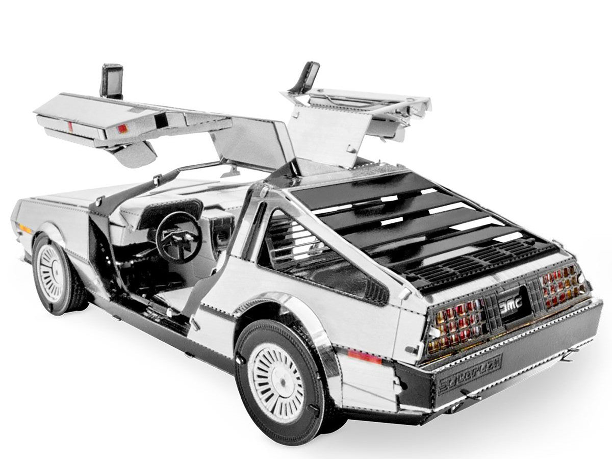 DeLorean metal model kit fully assembled showing brushed stainless steel finish and opening gull-wing doors — view 2