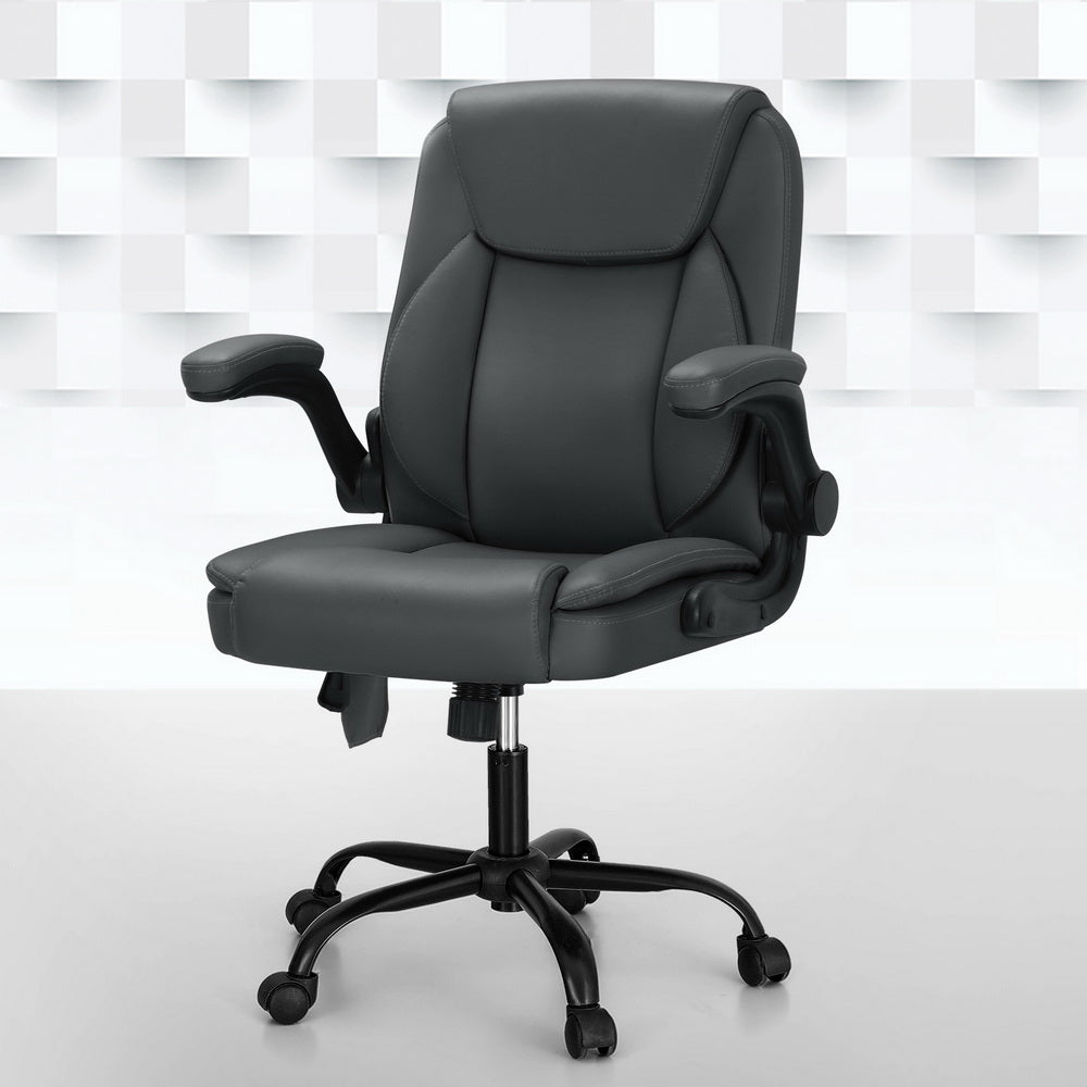 Grey massage office chair in PU leather with padded armrests and five-wheel swivel metal base