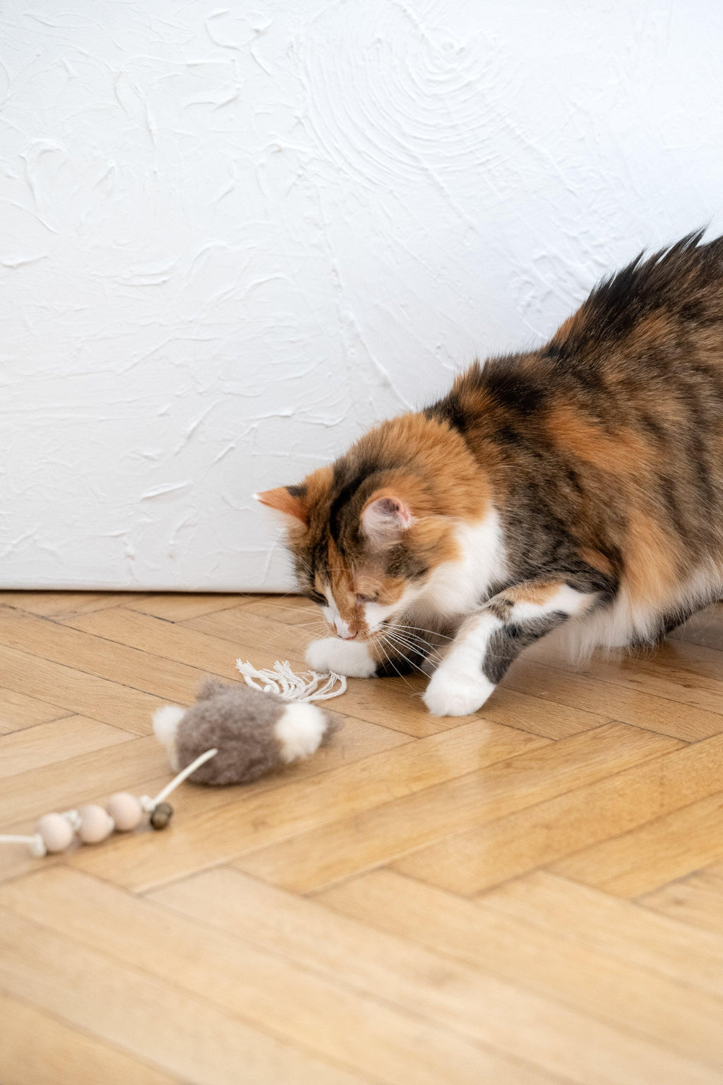 White natural sheepskin squid cat toy with jute string and wooden ball — view 3