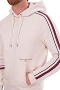 Cream-colored men's cotton hoodie with logo printed on front and signature sleeve taping