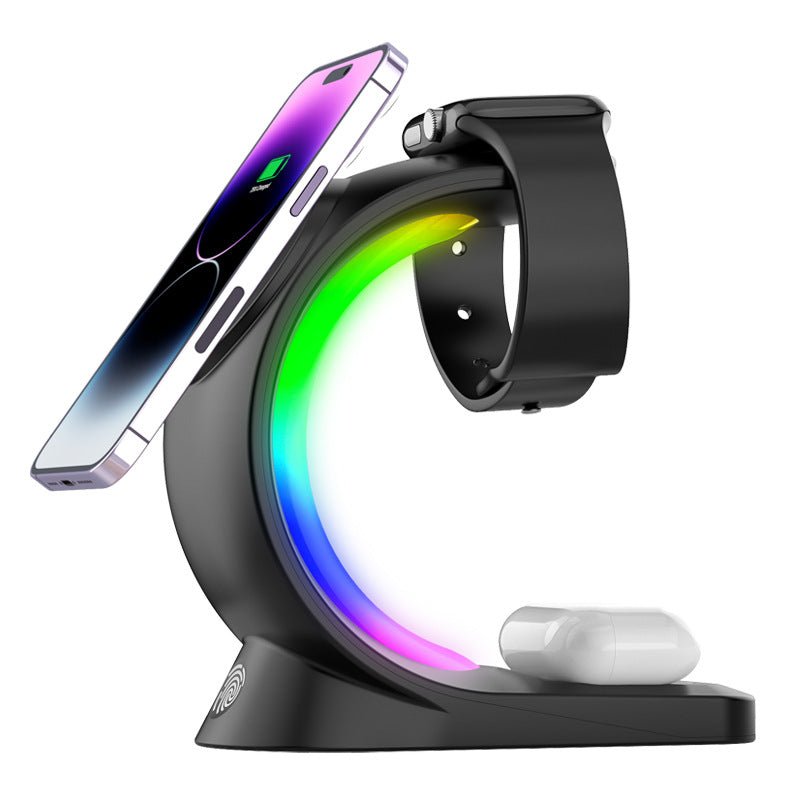 4-in-1 magnetic wireless charging station powering a smartphone, smartwatch, and earbuds with ambient light. — view 4