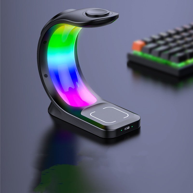 4-in-1 magnetic wireless charging station powering a smartphone, smartwatch, and earbuds with ambient light. — view 5