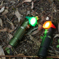 Black compact Manker E03H III flashlight and headlamp with elastic headband and attachable colored filters