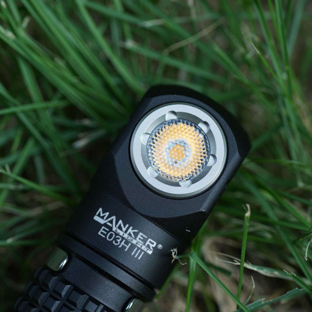 Black compact Manker E03H III flashlight and headlamp with elastic headband and attachable colored filters — view 4