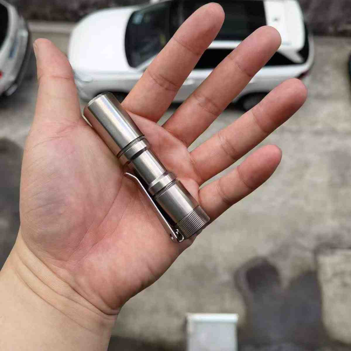 Manker E05II Ti EDC Flashlight in bead-blasted titanium with deep carry pocket clip