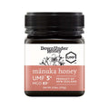 8.8oz jar of pure New Zealand UMF 5+ Manuka honey with a smooth golden creamy texture
