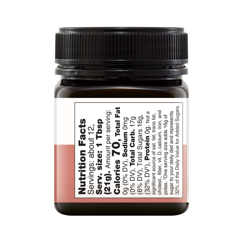 8.8oz jar of pure New Zealand UMF 5+ Manuka honey with a smooth golden creamy texture — view 3