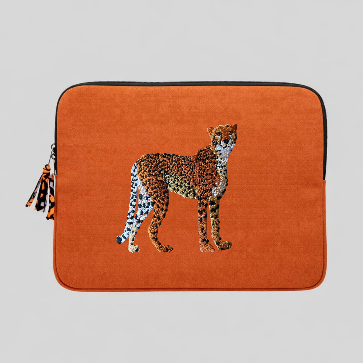 Handmade cotton canvas cheetah laptop sleeve in warm earthy tones featuring detailed animal embroidery — view 5