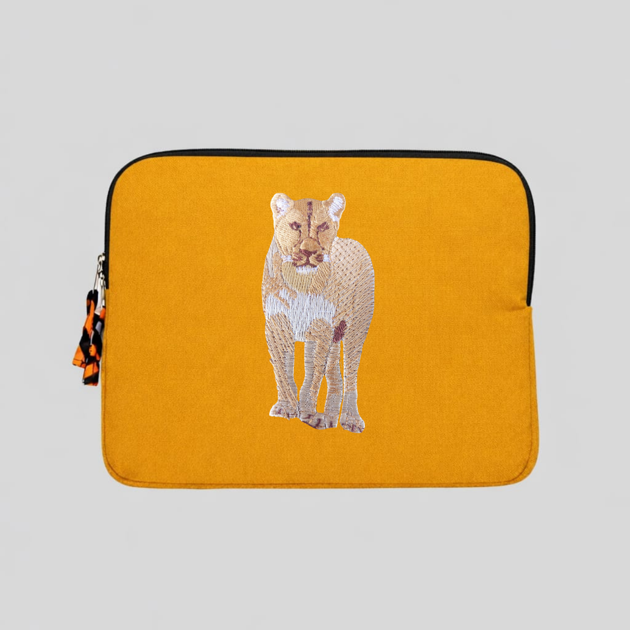 Lion laptop sleeve in handmade cotton canvas with intricate wildlife embroidery and protective padding. — view 3