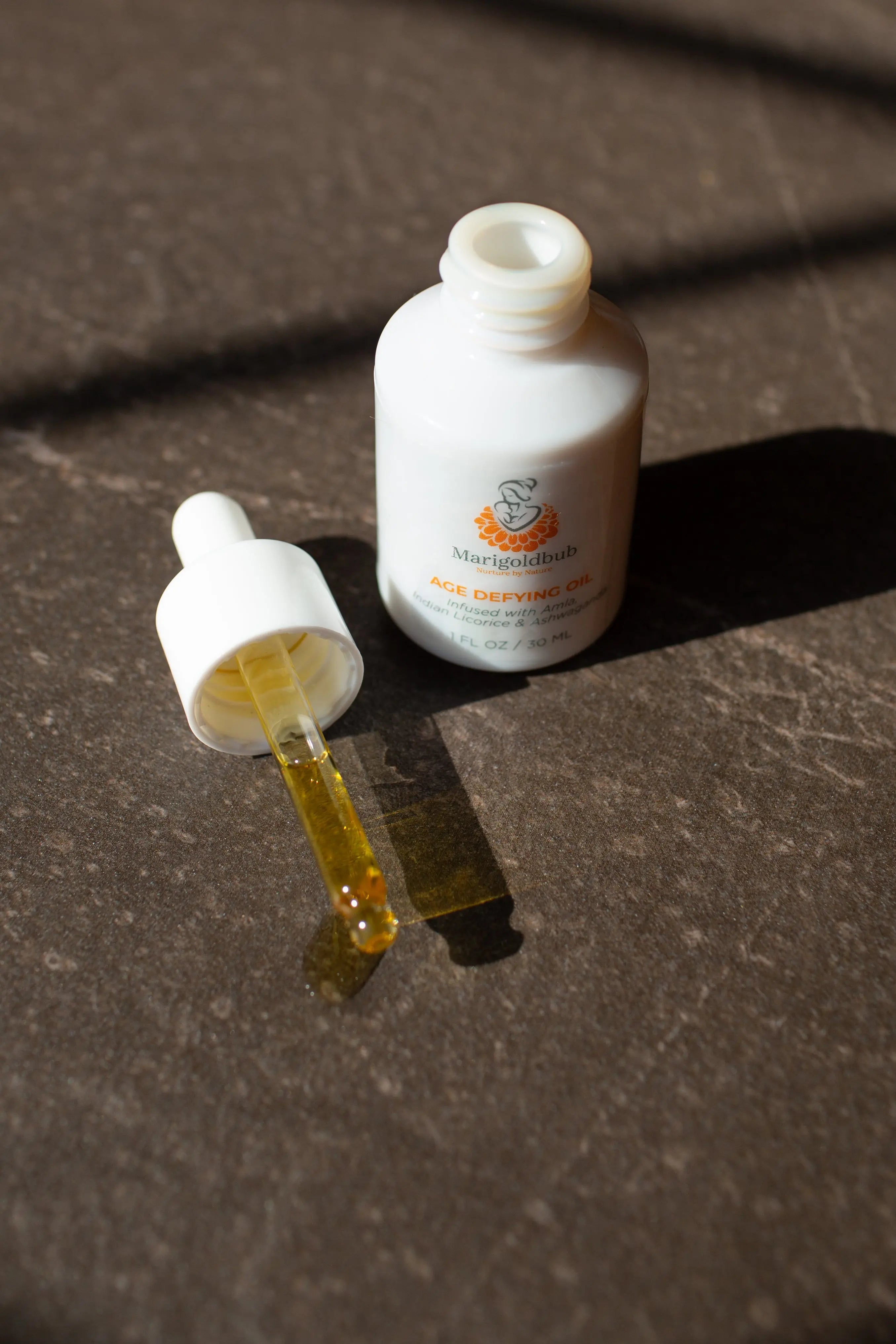 Age Defying Face Oil in a premium eco-friendly glass bottle with an easy application dropper. — view 2
