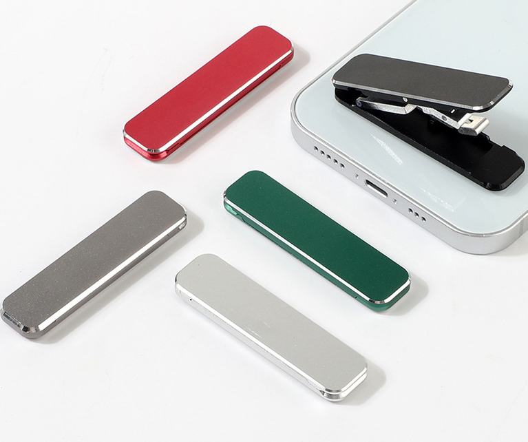 Mini folding mobile phone holder in aluminum alloy attached to the back of a smartphone — view 4