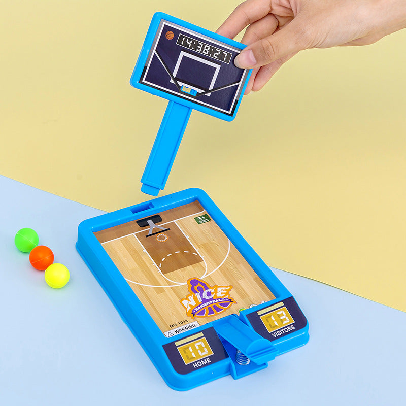 Mini desktop basketball game in blue and white plastic with three small orange balls — view 3