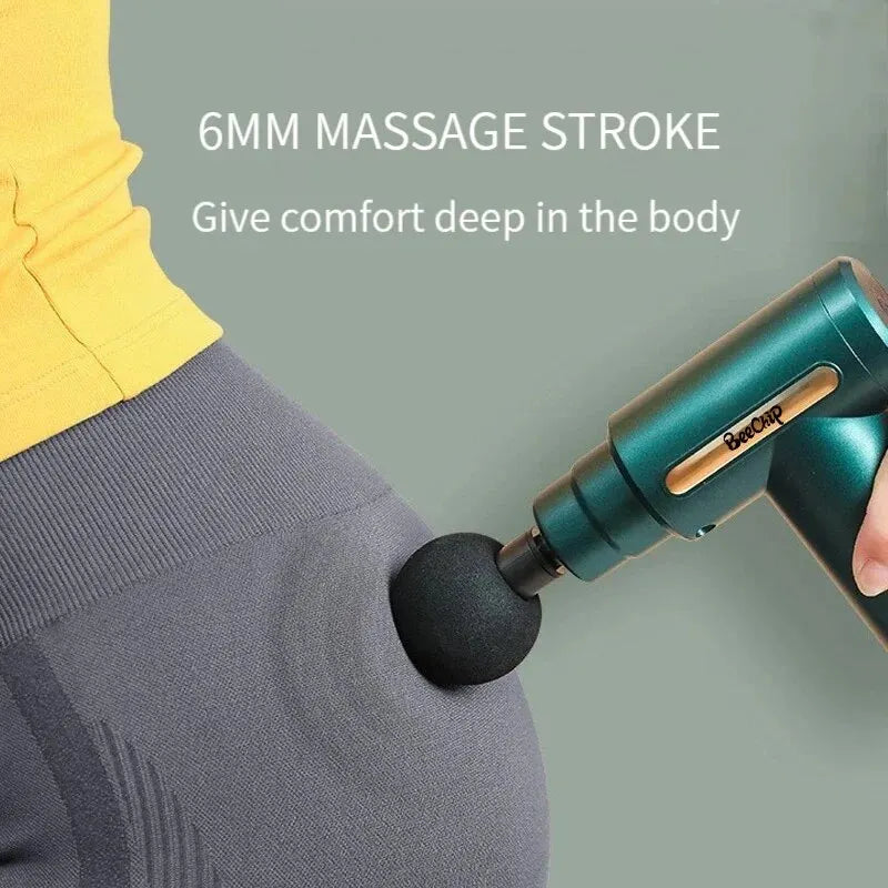 Compact cordless mini massage gun with four interchangeable heads for deep tissue muscle relief. — view 3