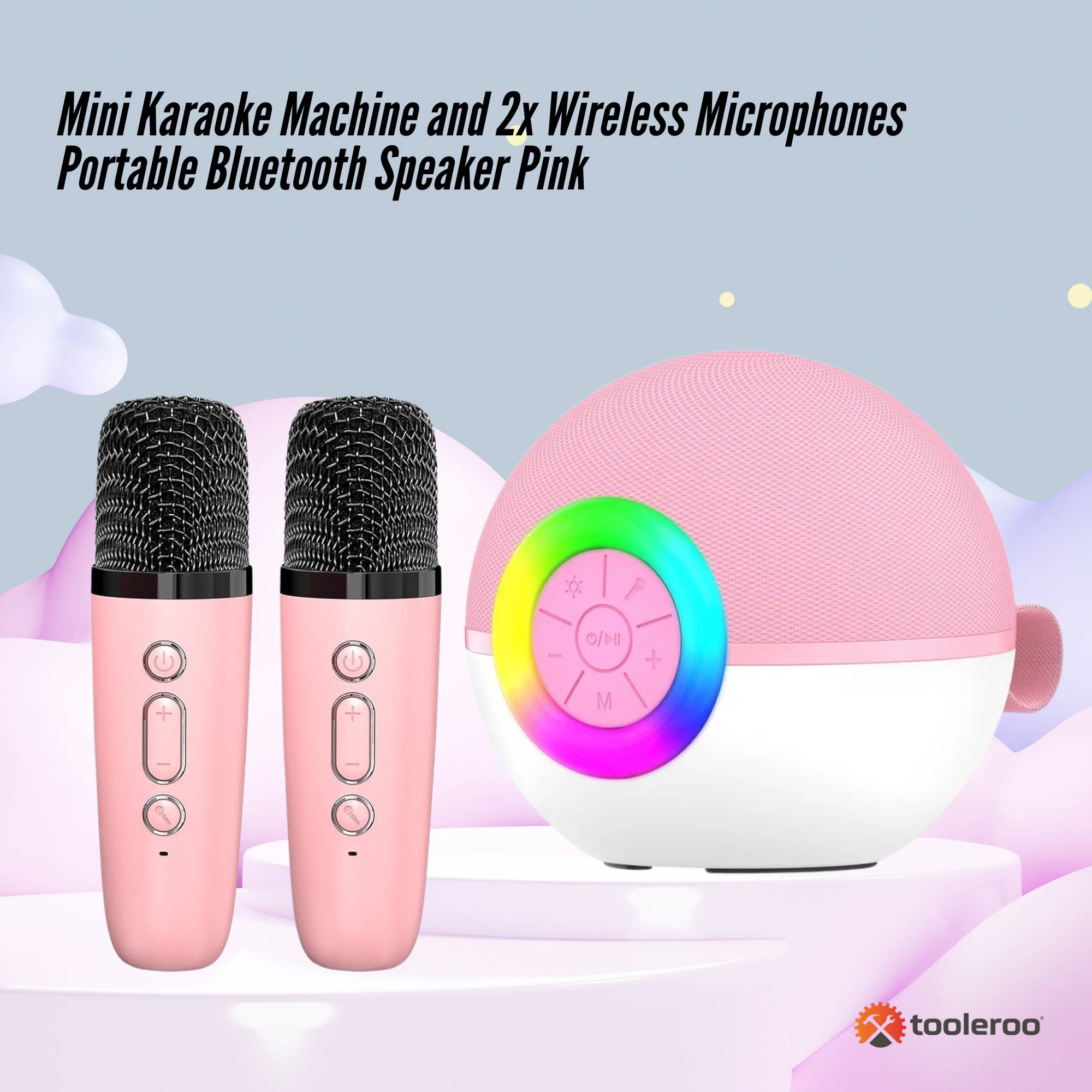 Pink mini karaoke machine speaker with two matching wireless microphones and vibrant LED lights — view 2