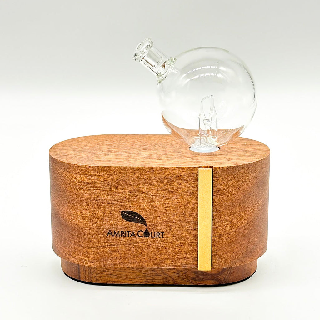 Portable waterless essential oil diffuser made of hand blown glass and African red wood base — view 2