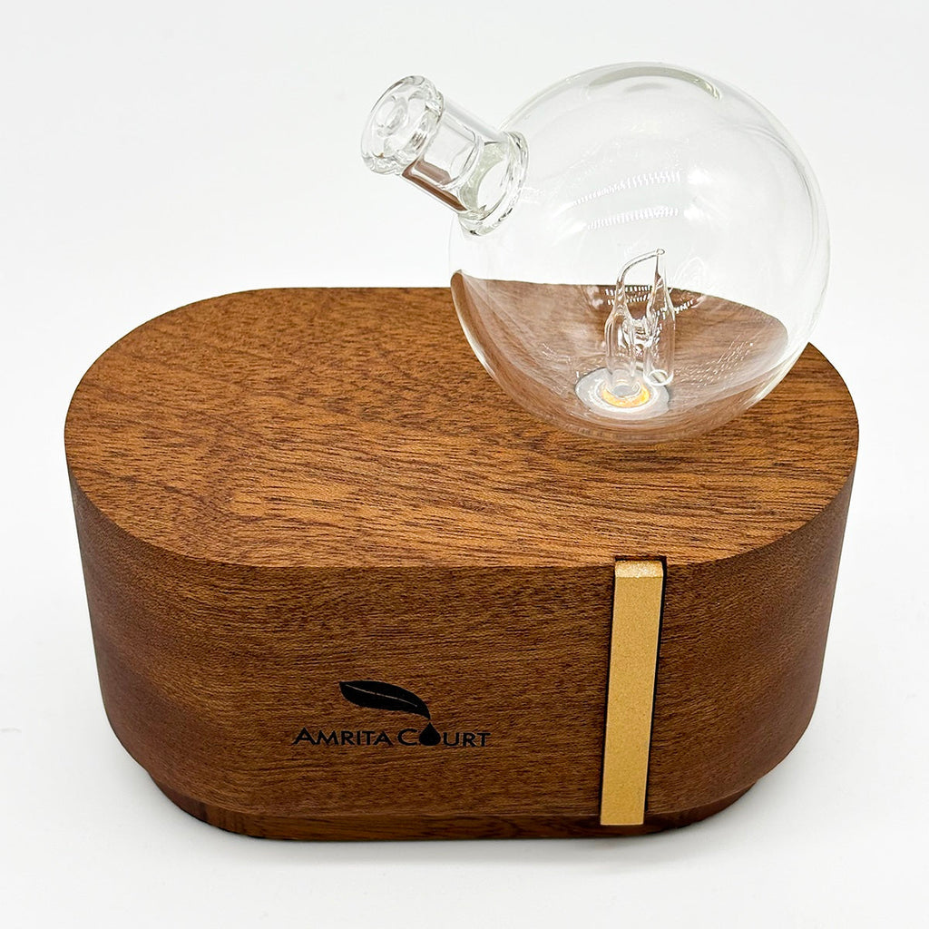 Portable waterless essential oil diffuser made of hand blown glass and African red wood base — view 3
