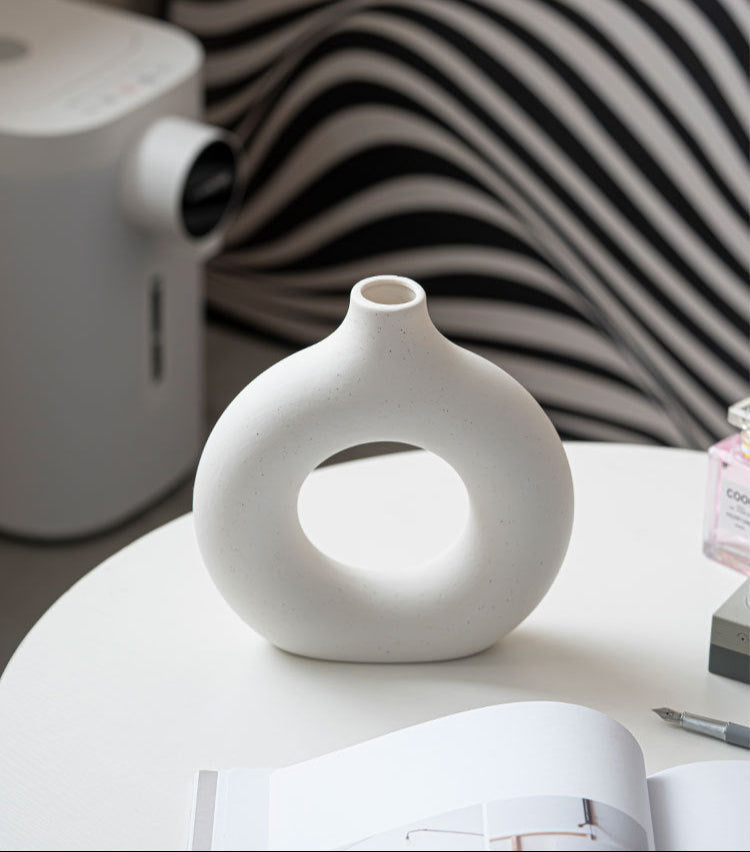 Modern Nordic circle ceramic vase in matte white, minimalist hollow sculptural decor for dried flowers — view 4