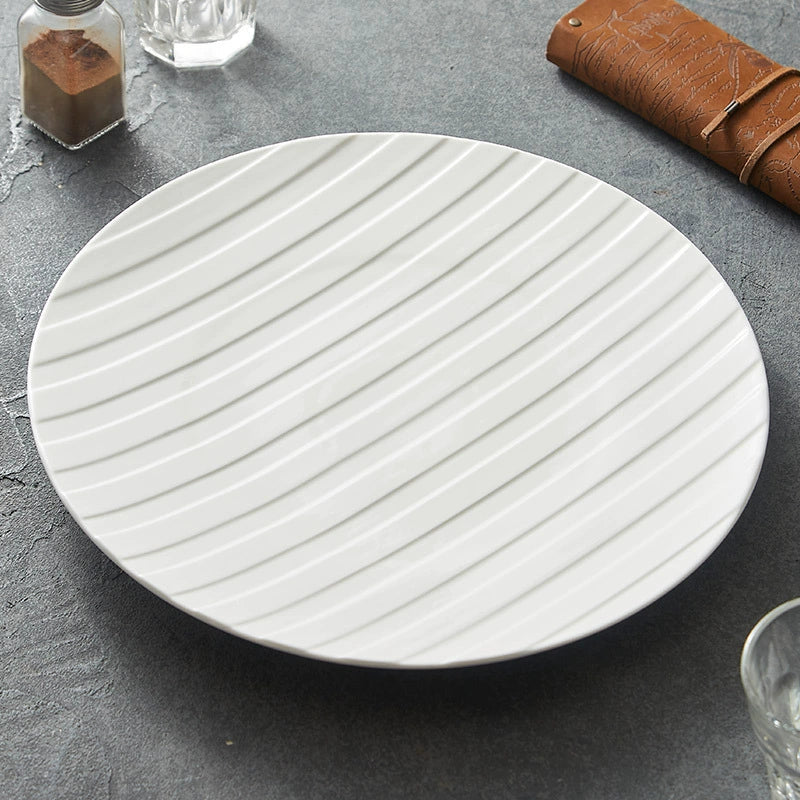 White ceramic plate with diagonal stripe relief texture for elegant modern dining presentations — view 4