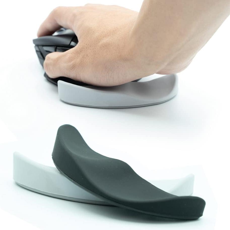 Ergonomic gliding silicone mouse wrist rest pad in black, providing comfortable desk and workstation support — view 2